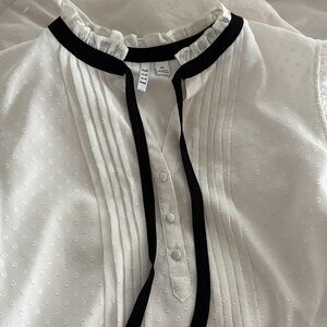 White Sleeveless Blouse with Black Trim